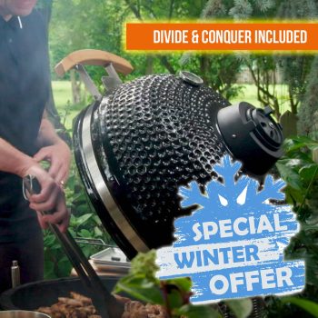 Man barbecuing with winter offer on kamado grill.
