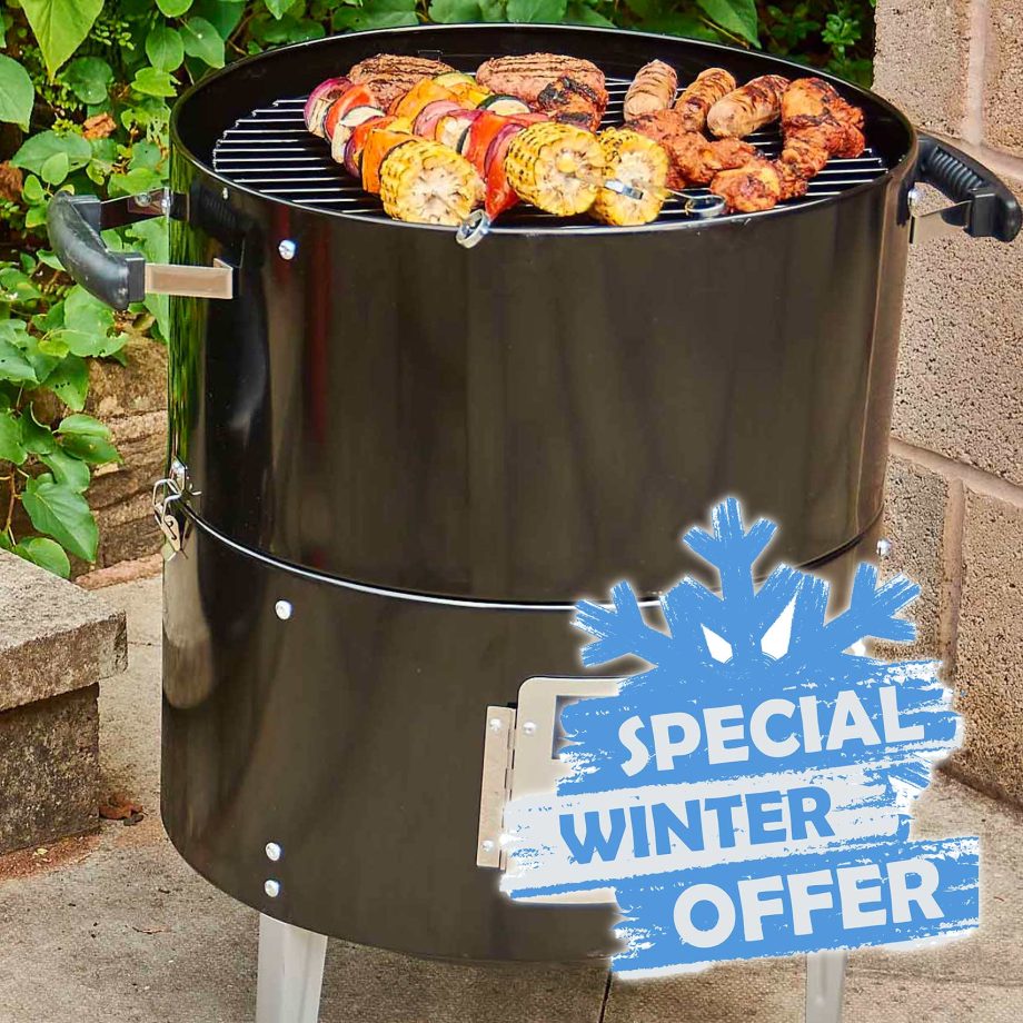 Charcoal grill with food and winter sale sign.